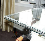 Re-assembled sealed double glazing unit